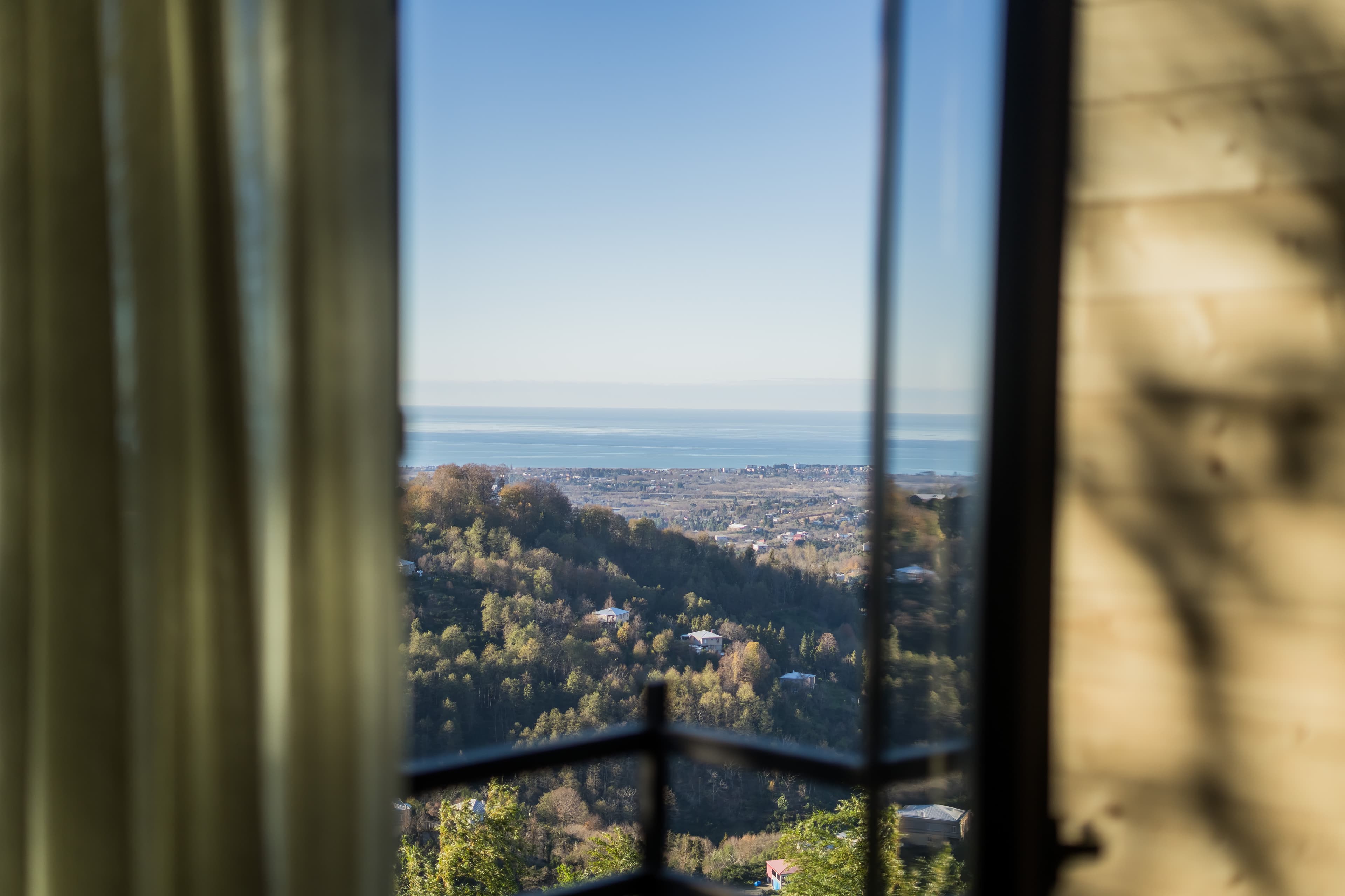 Sunset over the Black Sea seen through the triangular A-frame window